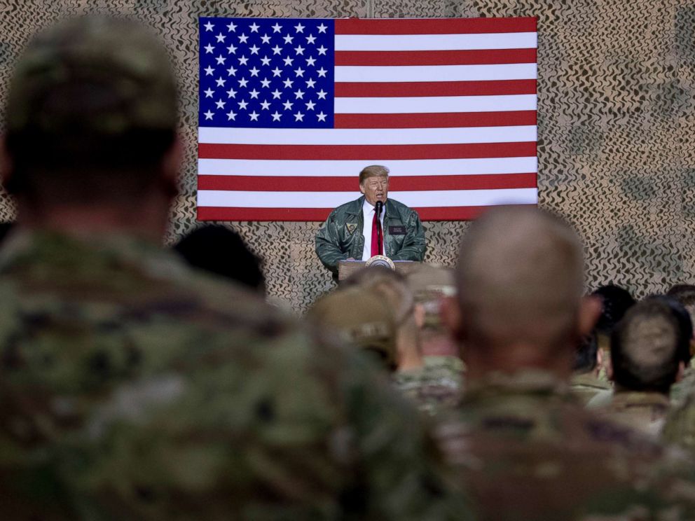 PHOTO: President Donald Trump speaks to members of the military at a hangar rally at Al Asad Air Base, Iraq, Dec. 26, 2018.