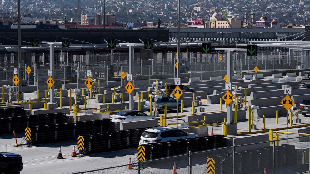 PHOTO: Vehicles enter the San Ysidro Port of Entry border checkpoint at the U.S. - Mexico border, Feb. 19, 2021, in San Diego, Calif.