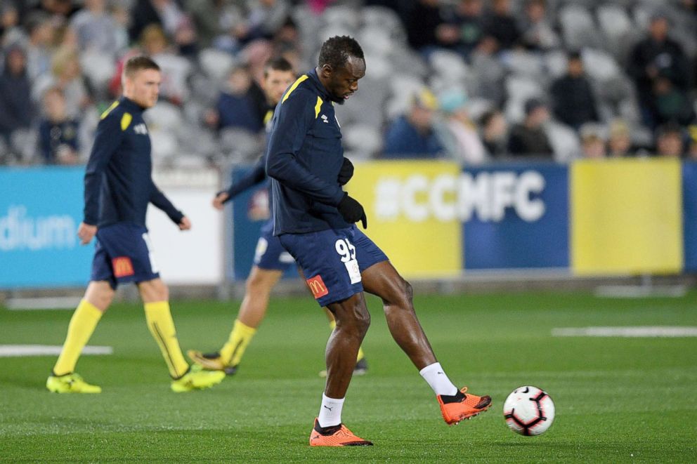 PHOTO: Usain Bolt, of the Mariners, warms up ahead of a Hyundai A-League trial match between the Central Coast Mariners and the Central Coast Select XI at Central Coast Stadium in Gosford, Australia, Aug. 31, 2018.