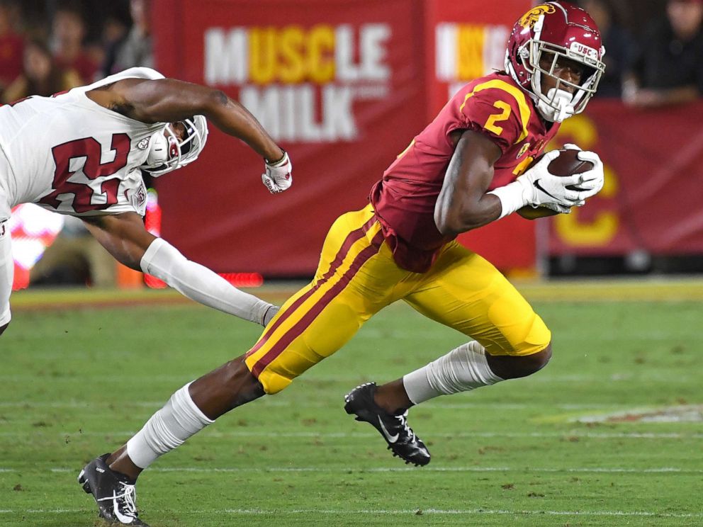 PHOTO: Wide receiver Devon Williams of the USC Trojans holds on to pass as he breaks loose from cornerback Obi Eboh  of the Stanford Cardinal for a first down in the first half of the game on September 7, 2019, in Los Angeles.