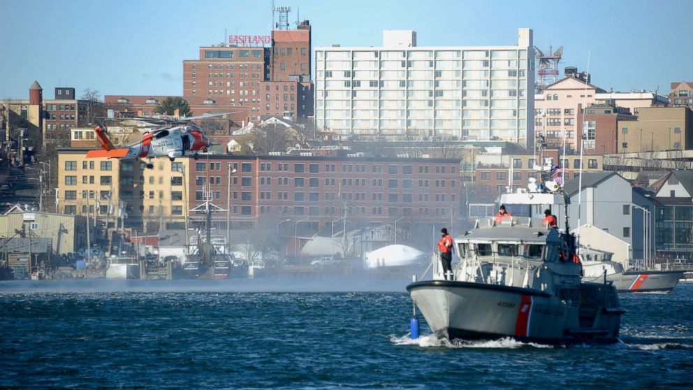PHOTO: U.S. Coast Guard Air Station Cape Cod and U.S. Coast Guard Sector Northern New England air and boat crews conduct a search and rescue demonstration, Dec. 7, 2018, at Casco Bay in Portland, Maine.