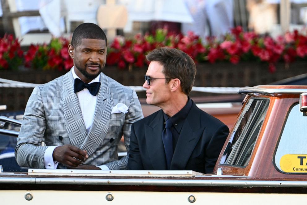 PHOTO: Usher and Tom Brady leave the Gritti Palace Hotel on the wedding day of Amazon founder Jeff Bezos with Lauren Sanchez, in Venice, June 27, 2025.