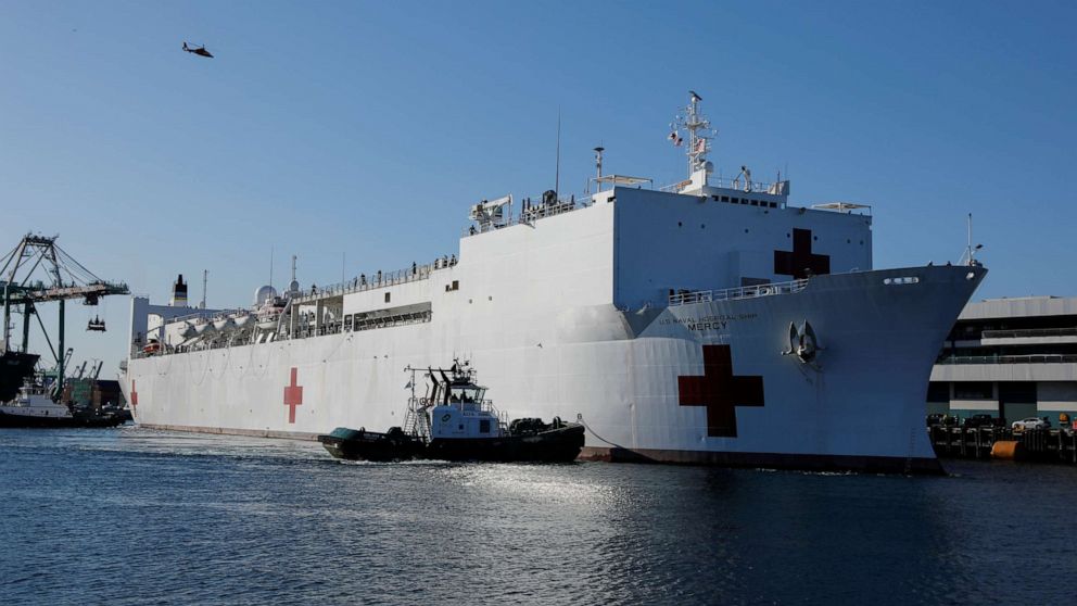 PHOTO: The USNS Mercy hospital ship arrives at the Port of Los Angeles to assist area medical facilities during the outbreak of the novel coronavirus, in Los Angeles, California, on March 27, 2020.