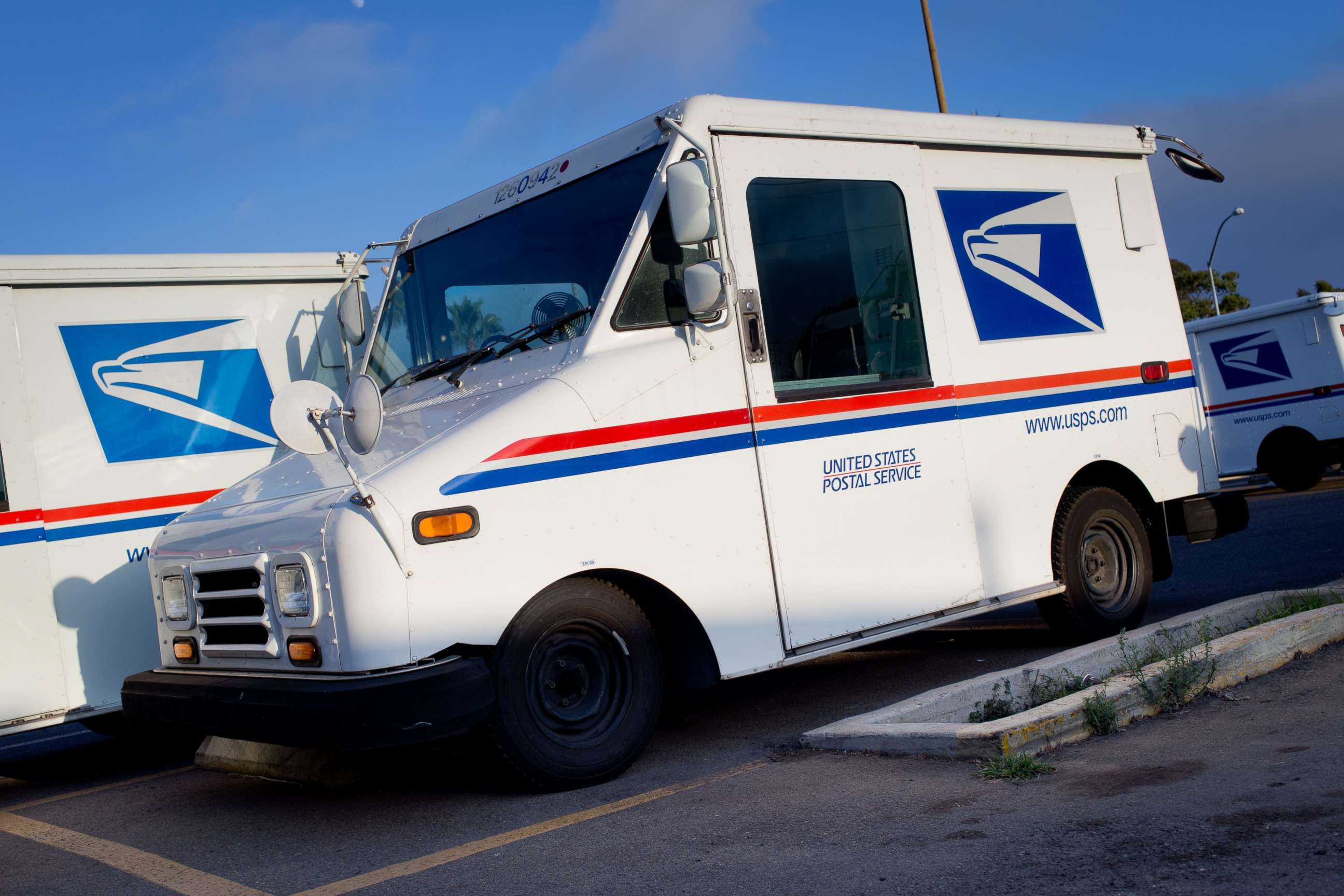 PHOTO: Mail trucks parked at the post office in Clairemont, in August 2017.