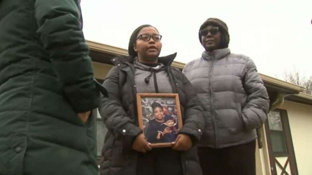 PHOTO: Jayla Shelton, center, holds a photo of her mother after she was killed in a shooting on a highway near Chicago on Monday, Jan. 4, 2019.