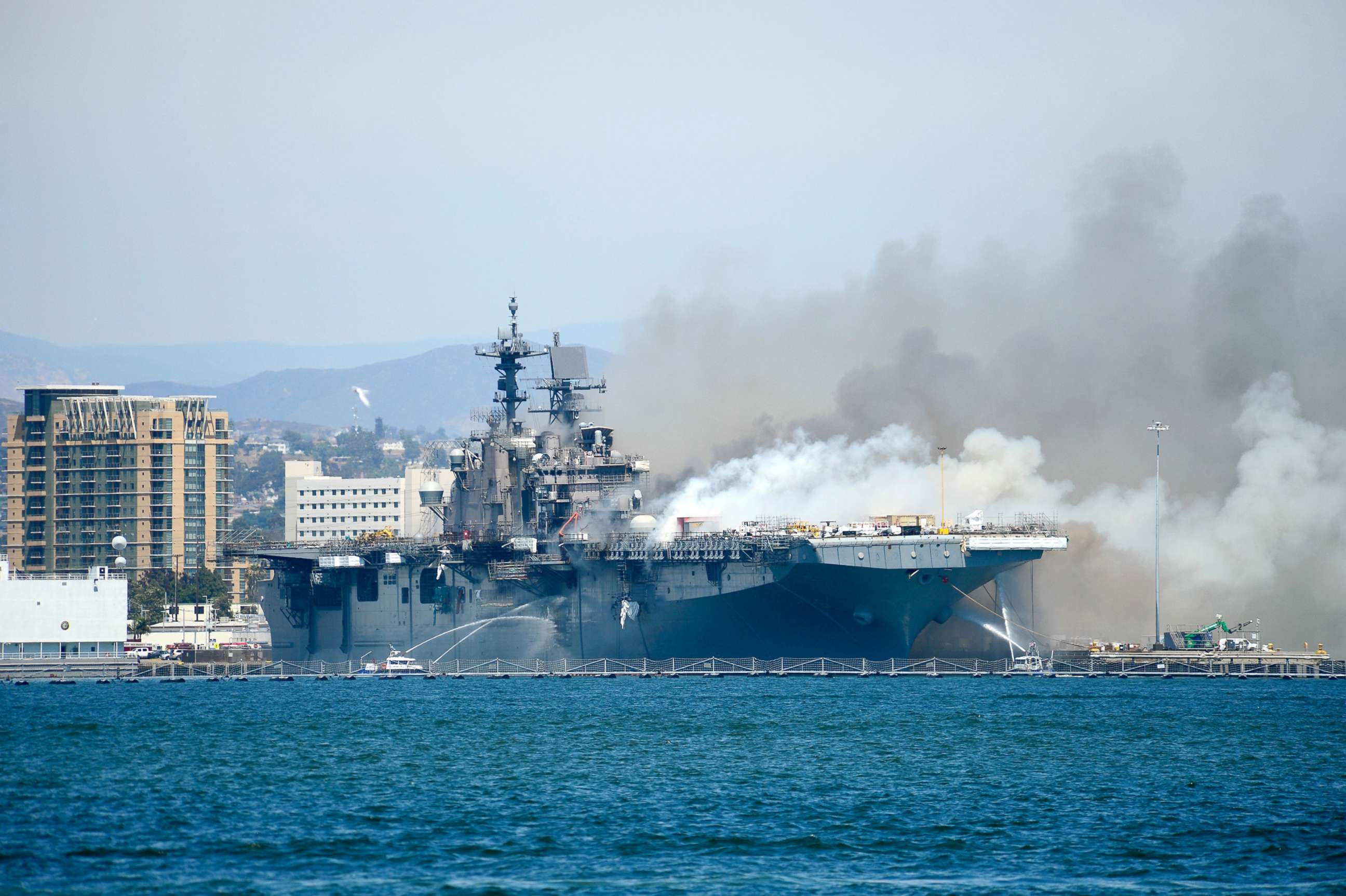 PHOTO: Port of San Diego Harbor Police Department boats combat a fire on board the U.S. Navy amphibious assault ship USS Bonhomme Richard at Naval Base San Diego, Calif., July 12, 2020.