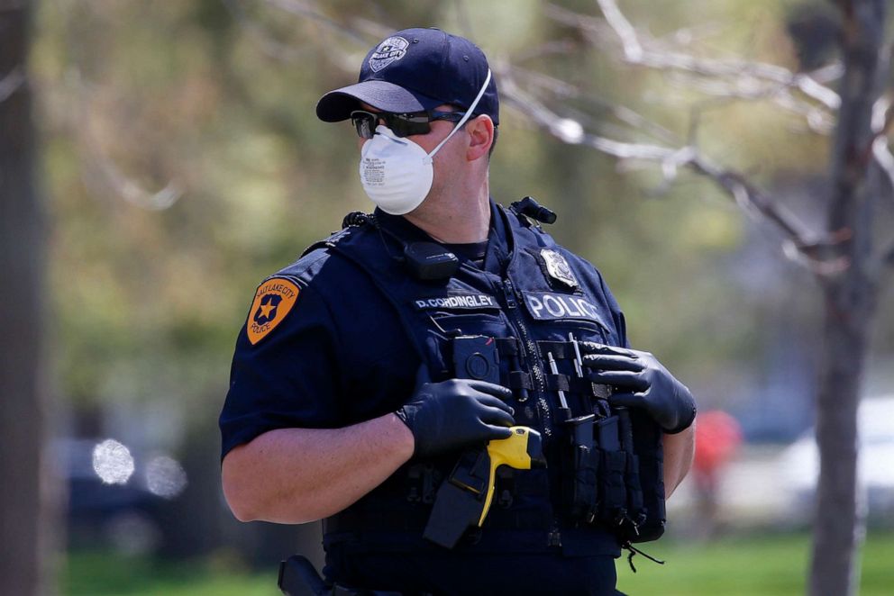 PHOTO: Salt Lake City police officers wear face masks to protect against the spread of the new coronavirus as they patrol in Salt Lake City, Utah, April 21, 2020. 