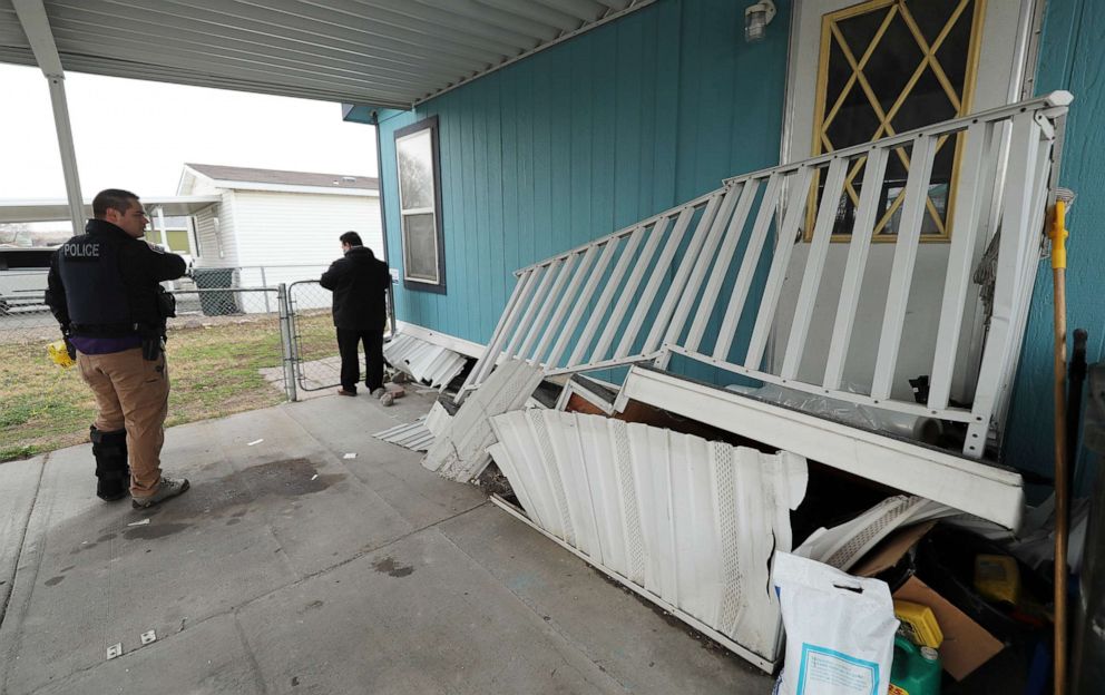 PHOTO: Members of law enforcement survey damage to a mobile home at Western Estates in Magna, Utah, after 5.7-magnitude earthquake had shaken Salt Lake City and many of its suburbs, March 18, 2020.