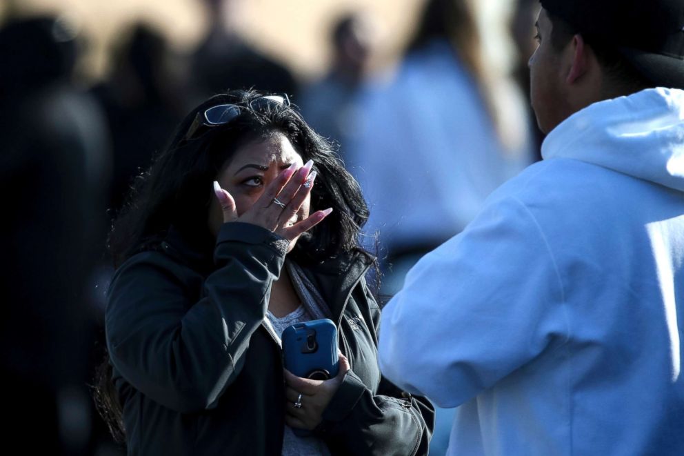 PHOTO: Evelyn Salazar Atwood wipes tears from her eyes after reuniting with her son, Chris Salazar, who works at Fashion Place Mall, after a shooting at the mall in Murray, Utah, Jan. 13, 2019.