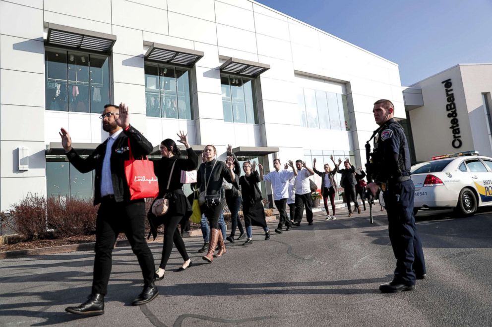 PHOTO: People evacuate after a reported shooting at Fashion Place Mall in Murray, Utah on Jan. 13, 2019.