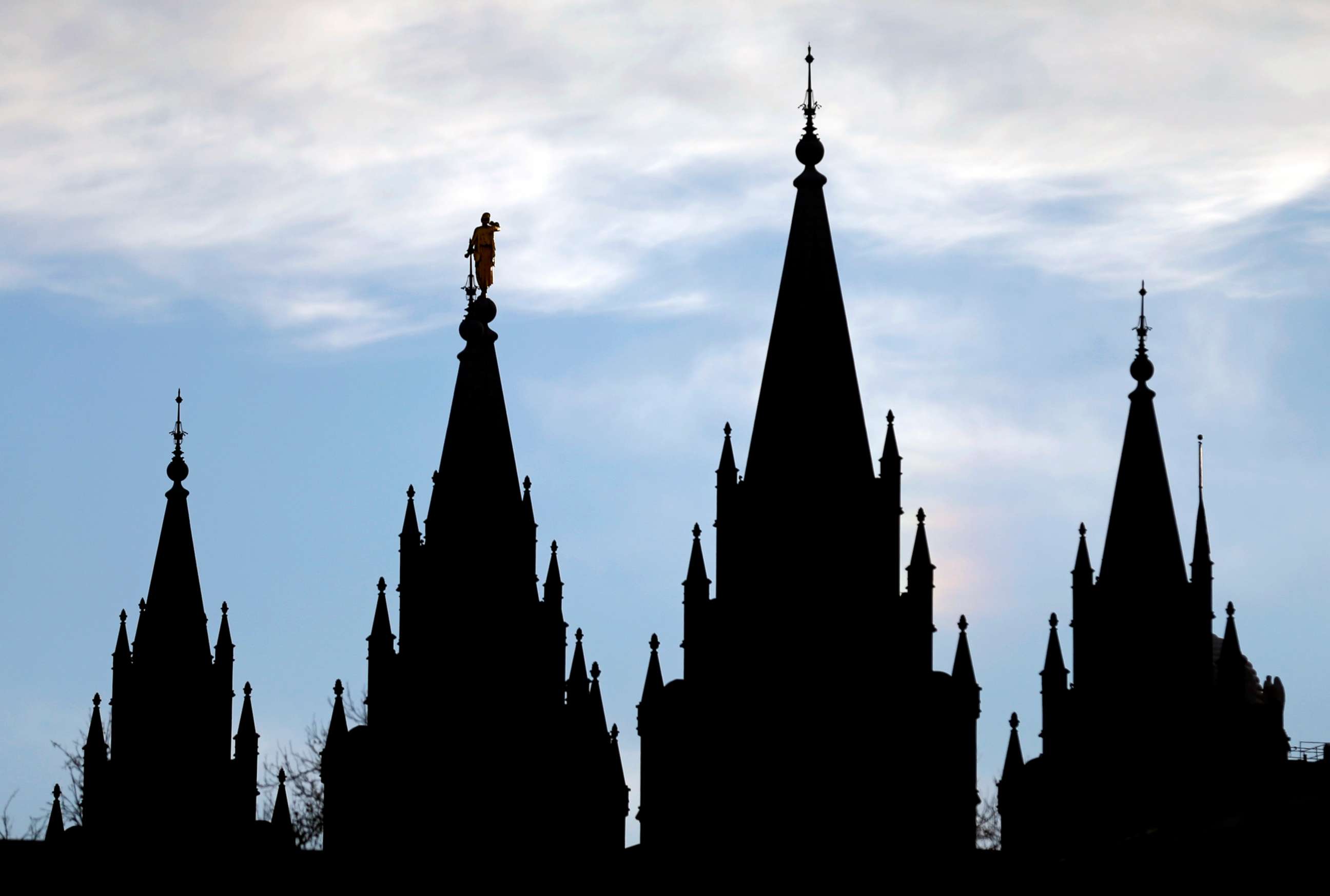 PHOTO: The angel Moroni statue, silhouetted against the sky, sits atop the Salt Lake Temple at Temple Square in Salt Lake City, Jan. 3, 2018.