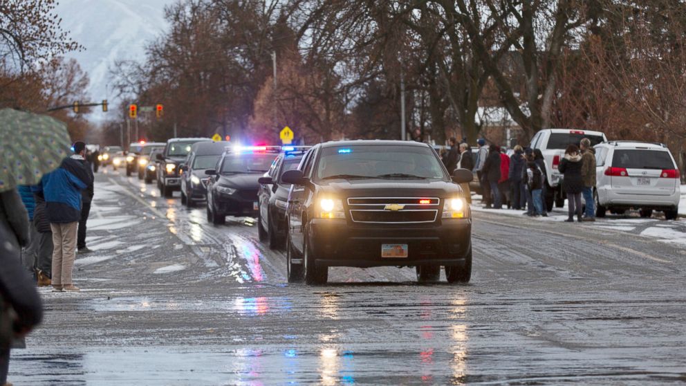 PHOTO: A procession of law enforcement vehicles escorting the hearse carrying Provo Police Officer Joseph Shinners makes its way to Wheeler Mortuary in Springville, Utah, Jan. 6, 2019.