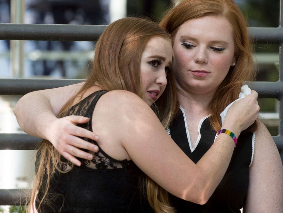 PHOTO:Kennedy Stoner, left, and Ashley Fine comfort each other during a vigil for Mackenzie Lueck, July 1, 2019, in Salt Lake City.