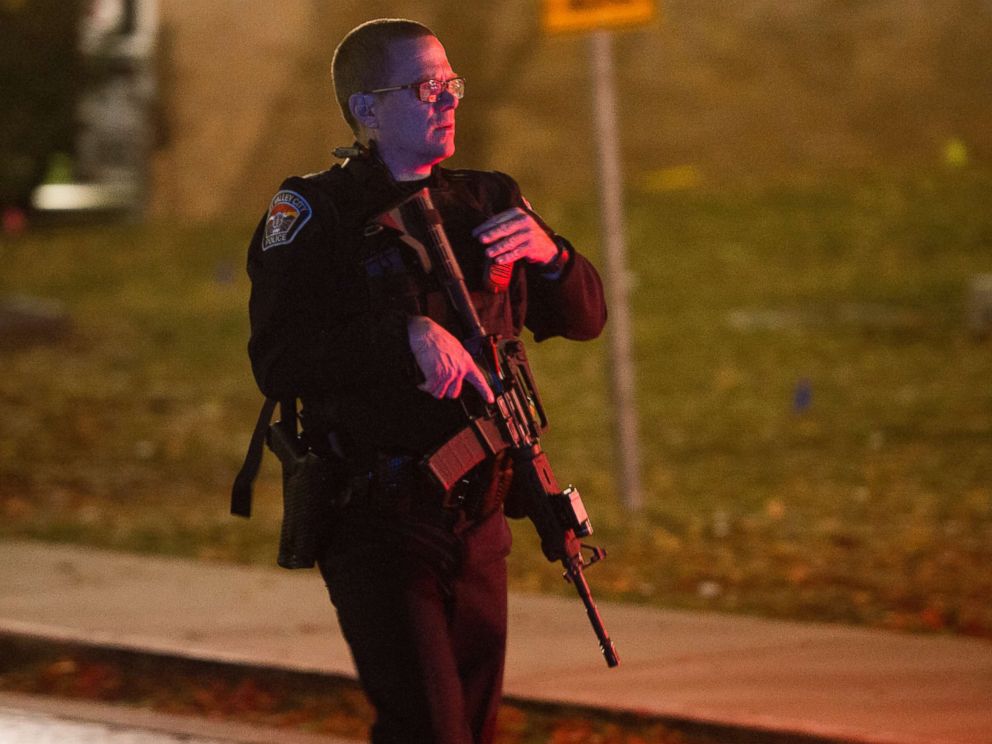 PHOTO: A police officer searches for a gunman near the University of Utah campus in Salt Lake City, Oct. 30, 2017. Police say a deadly shooting occurred near the school campus on Monday. 