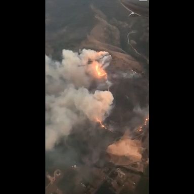 Aircraft and ground crews fight the Big Hollow Fire, which has grown to 500 acres near Daniel, Utah, as voluntary evacuation notices are in place for some areas.