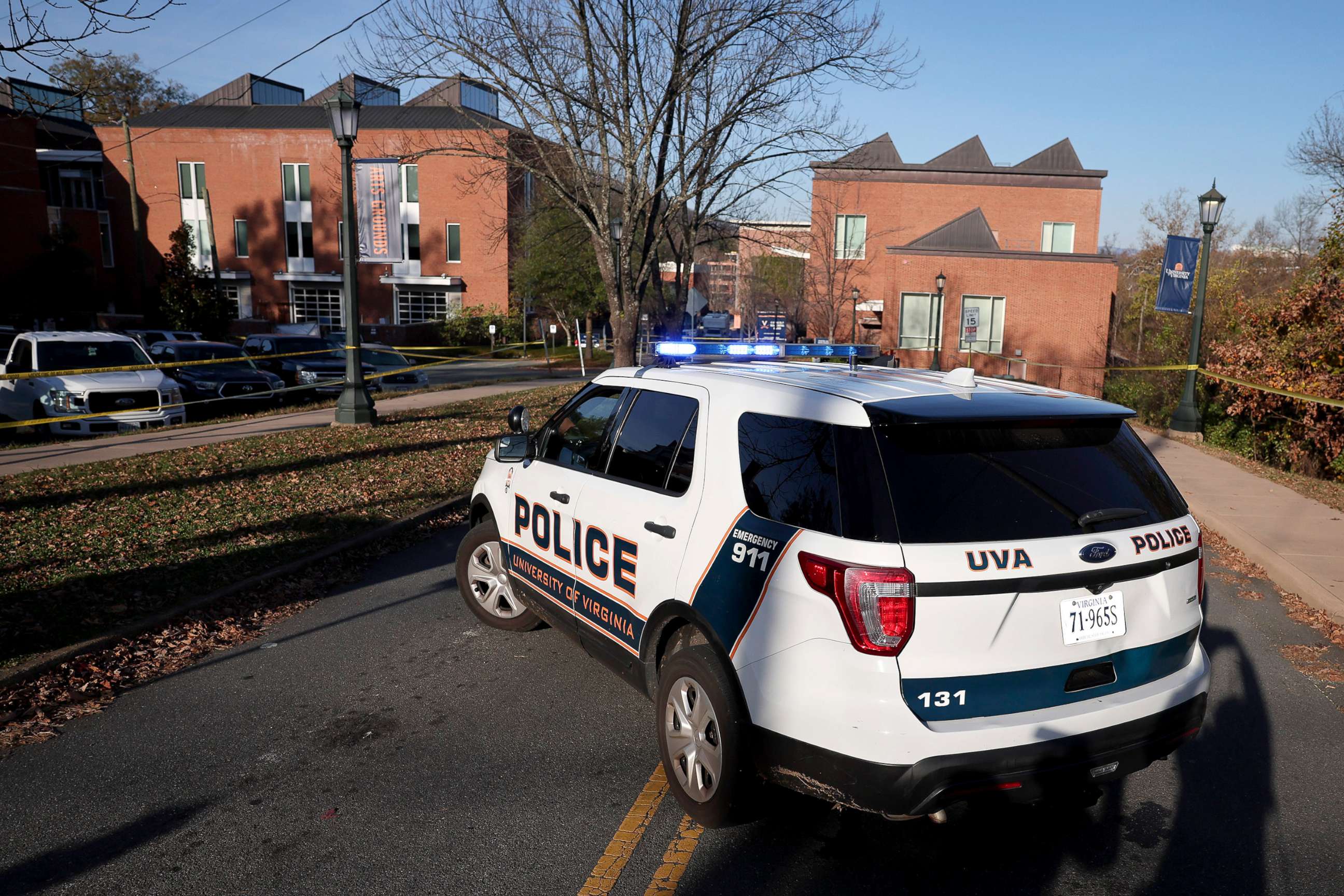 PHOTO: A law enforcement blocks access to the crime scene where there was a shooting on the grounds of the University of Virginia, Nov. 14, 2022 in Charlottesville.