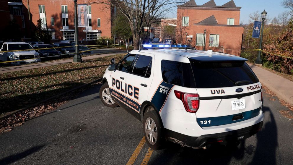 PHOTO: A law enforcement blocks access to the crime scene where there was a shooting on the grounds of the University of Virginia, Nov. 14, 2022 in Charlottesville.