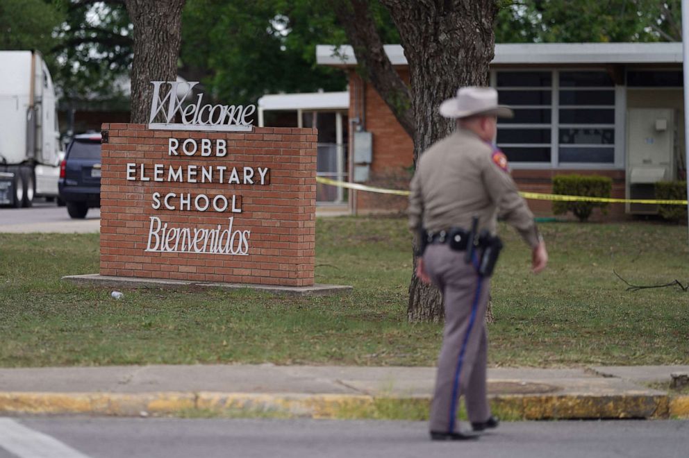 PHOTO: A police officer walks outside of Robb Elementary School, May 24, 2022, in Uvalde, Texas.