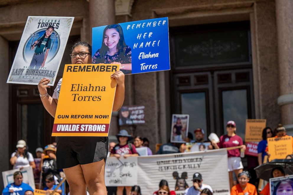 PHOTO: The Torres family stand holding signs of Eliahna Torres, one of the children murdered during the mass shooting at Robb Elementary School, during a March For Our Lives rally, Aug. 27, 2022, in Austin, Texas. 