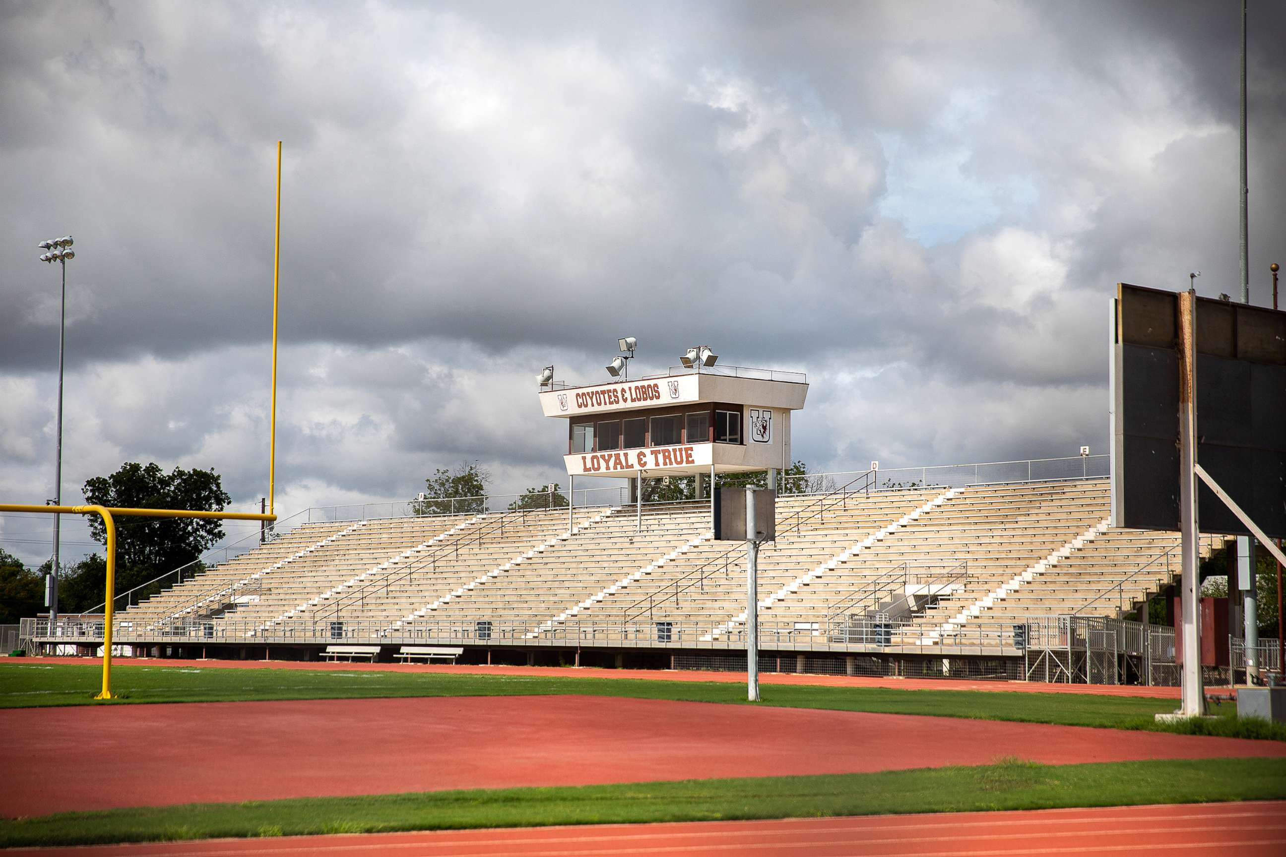 PHOTO: A sign saying "Coyotes & Lobos Loyal & True" is seen in the stands of the Honey Bowl Stadium in Uvalde, Texas, on Aug. 21, 2022. 