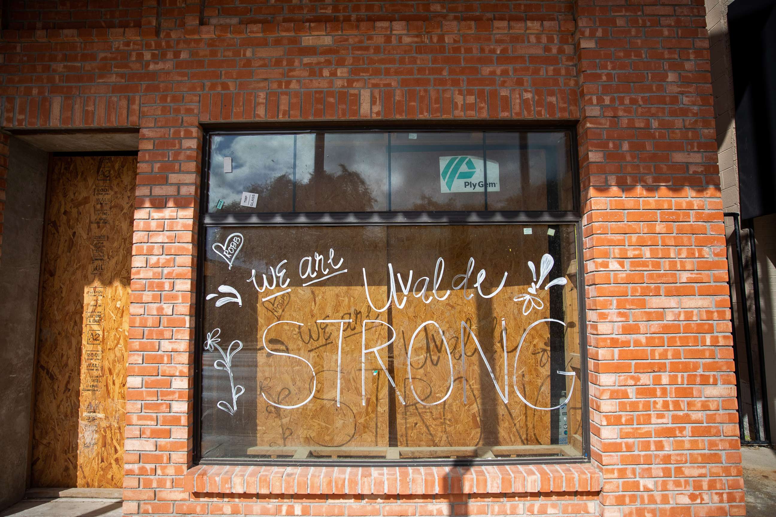 PHOTO: "Uvalde Strong" is seen written on the window of a building in downtown Uvalde, Texas, on Aug. 21, 2022.