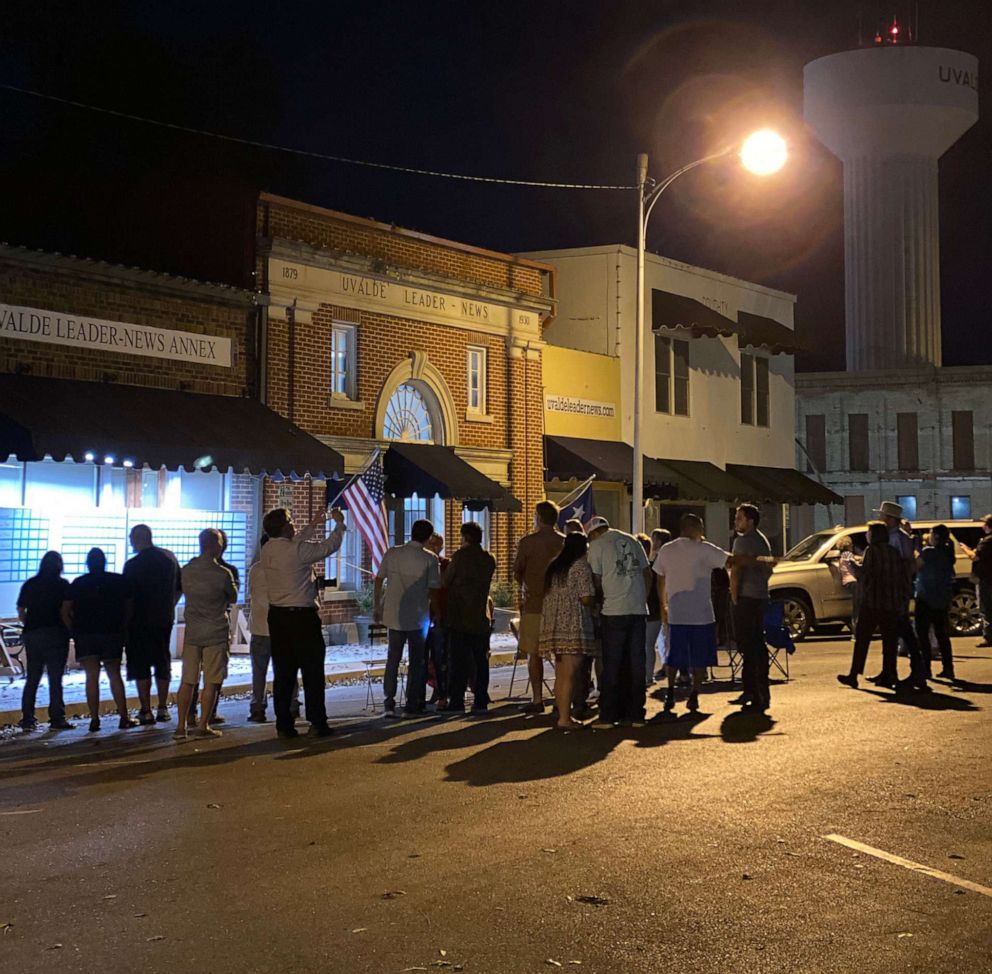 PHOTO: Community members gather outside the Uvalde Leader-News on election night in Uvalde, Texas, Nov. 8, 2022.