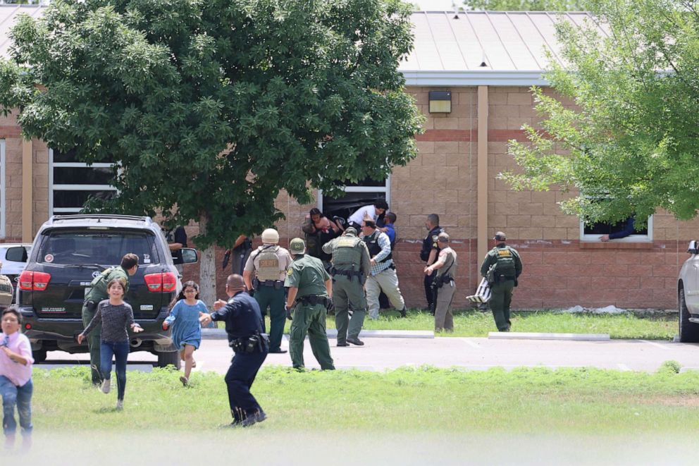 PHOTO: Students escape through a window during the mass shooting at Robb Elementary School, May 24, 2022, in Uvalde, Texas.
