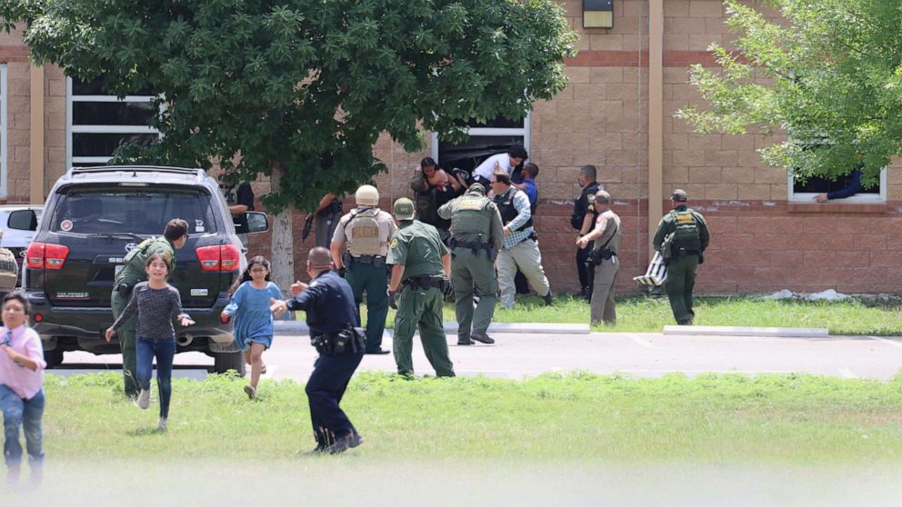 PHOTO: Students escape through a window during the mass shooting at Robb Elementary School, May 24, 2022, in Uvalde, Texas.