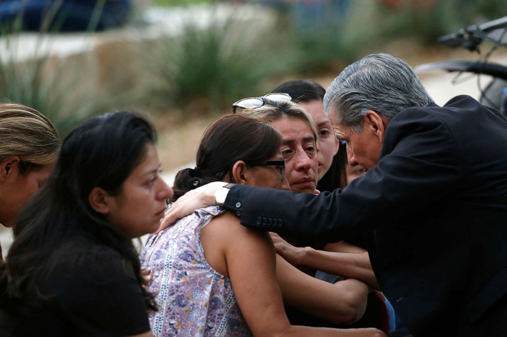PHOTO: The archbishop of San Antonio, Gustavo Garcia-Siller, comforts families outside the Civic Center following a deadly school shooting at Robb Elementary School in Uvalde, Texas, on May 24, 2022.