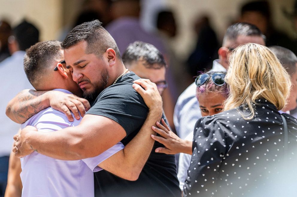 PHOTO: People grieve and embrace outside of Amerie Jo Garza's, 10, funeral service, May 31, 2022 in Uvalde, Texas.