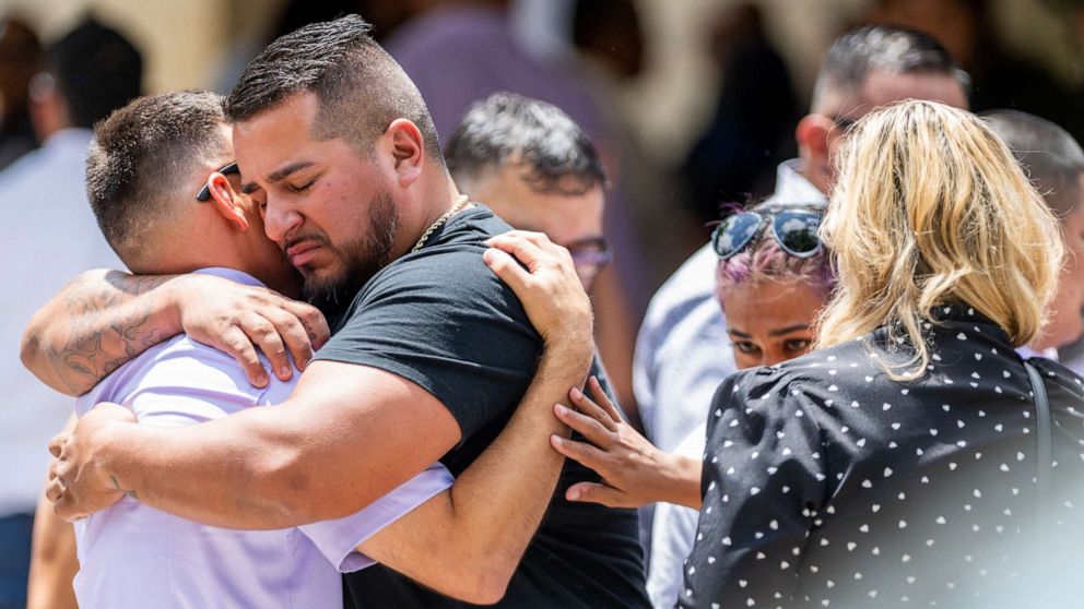 PHOTO: People grieve and embrace outside of Amerie Jo Garza's, 10, funeral service, May 31, 2022 in Uvalde, Texas.
