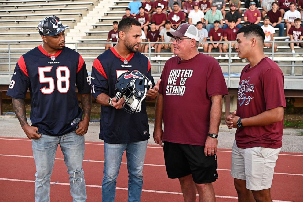 PHOTO: Houston Texans players join the Uvalde football team ahead of the high school's first home game, Sept. 2, 2022.