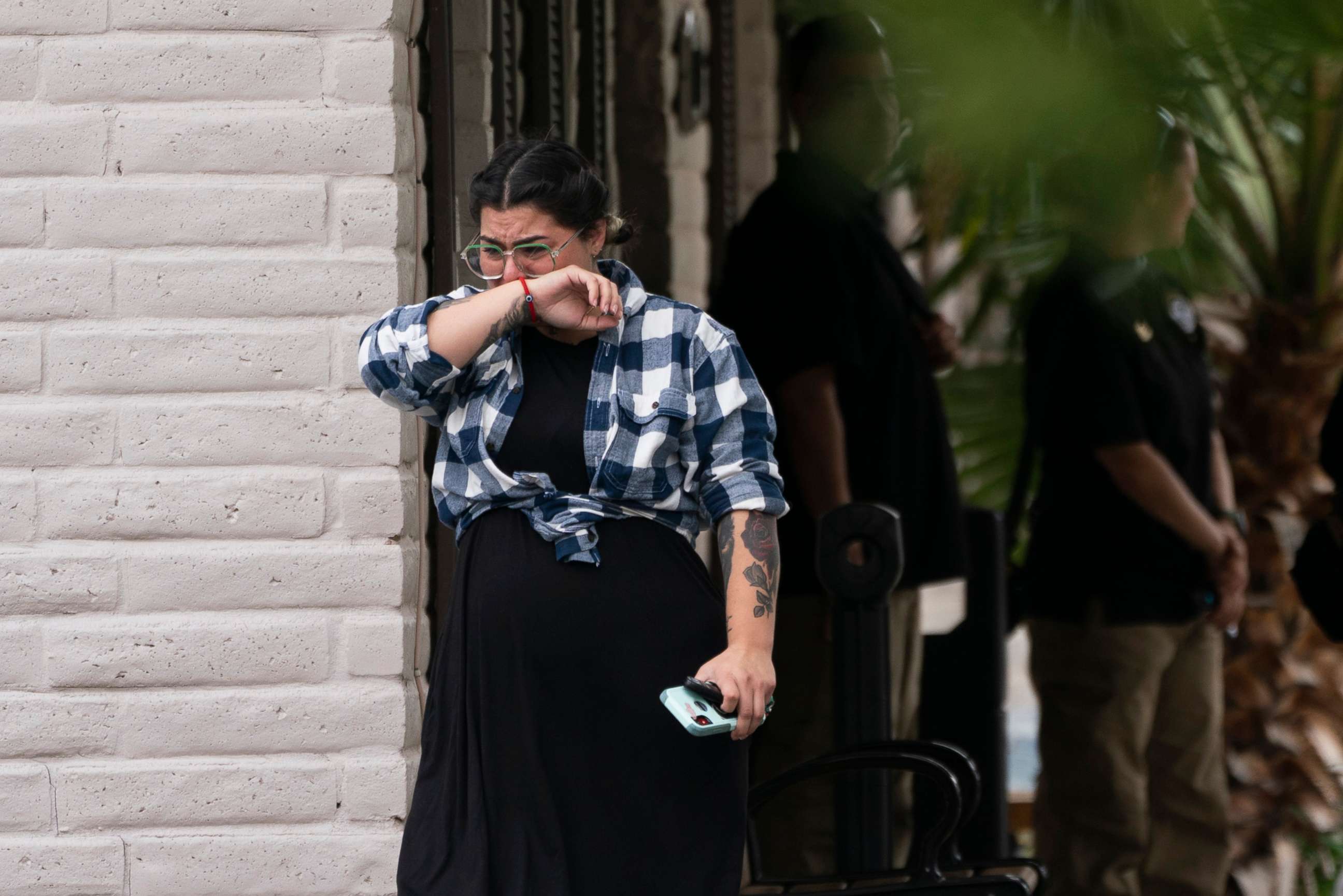 PHOTO: A woman weeps as she leaves a funeral home after attending a visitation for Nevaeh Bravo, one of the victims killed in last week's Robb Elementary School shooting, in Uvalde, Texas, May 31, 2022.