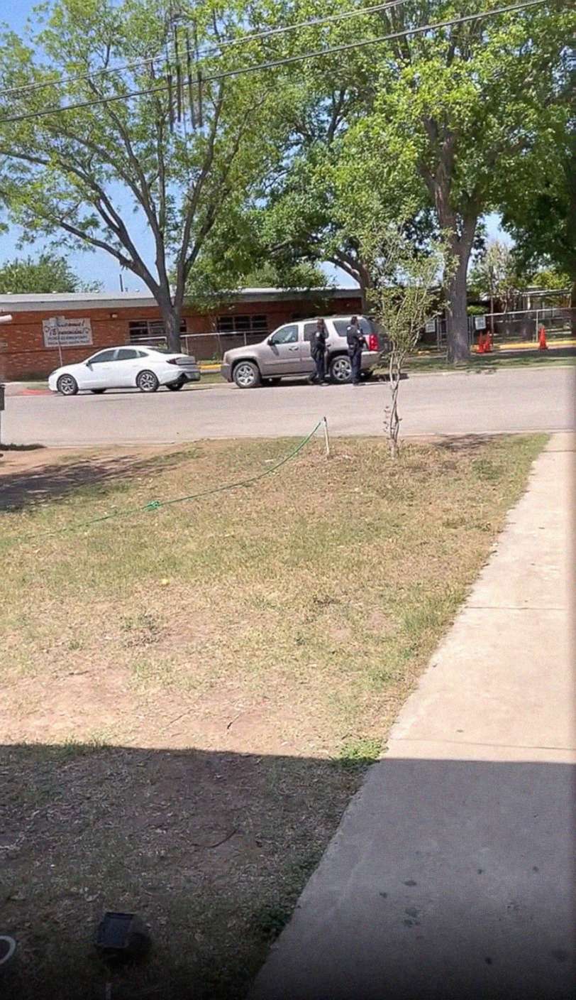 PHOTO: Law enforcement is seen outside Robb Elementary School in Uvalde, Texas, on May 24, 2022, in an image taken from a video made by a bystander. 
