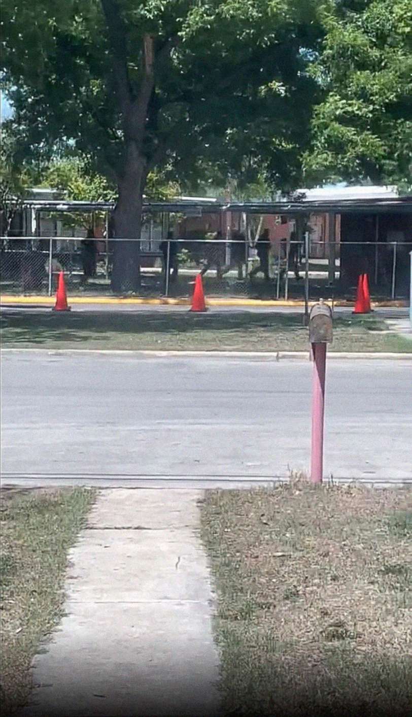 PHOTO: Law enforcement is seen outside Robb Elementary School in Uvalde, Texas, on May 24, 2022, in an image taken from a video made by a bystander. 