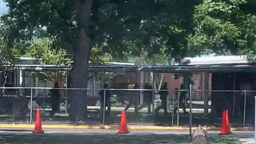 PHOTO: Law enforcement is seen outside Robb Elementary School in Uvalde, Texas, on May 24, 2022, in an image taken from a video made by a bystander. 