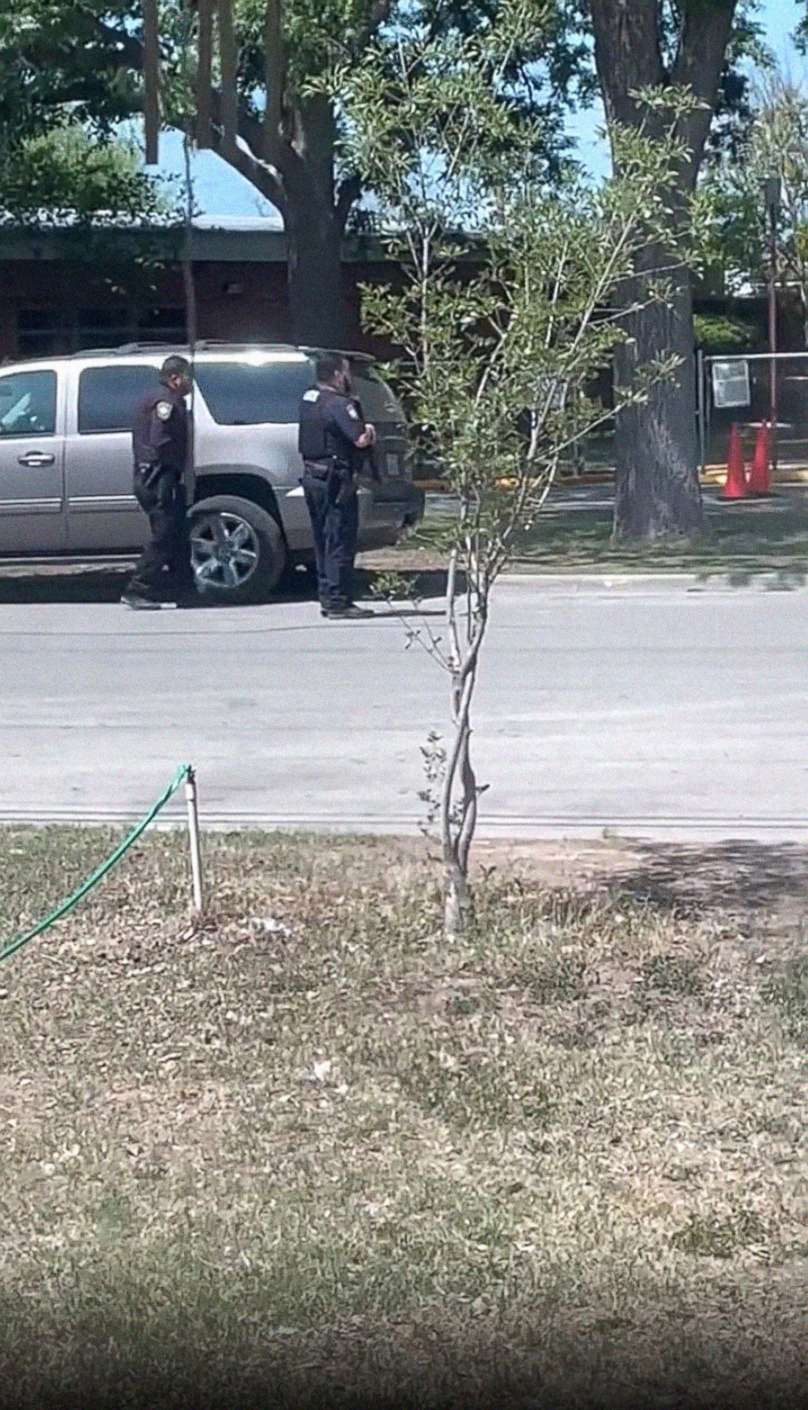 PHOTO: Law enforcement is seen outside Robb Elementary School in Uvalde, Texas, on May 24, 2022, in an image taken from a video made by a bystander. 