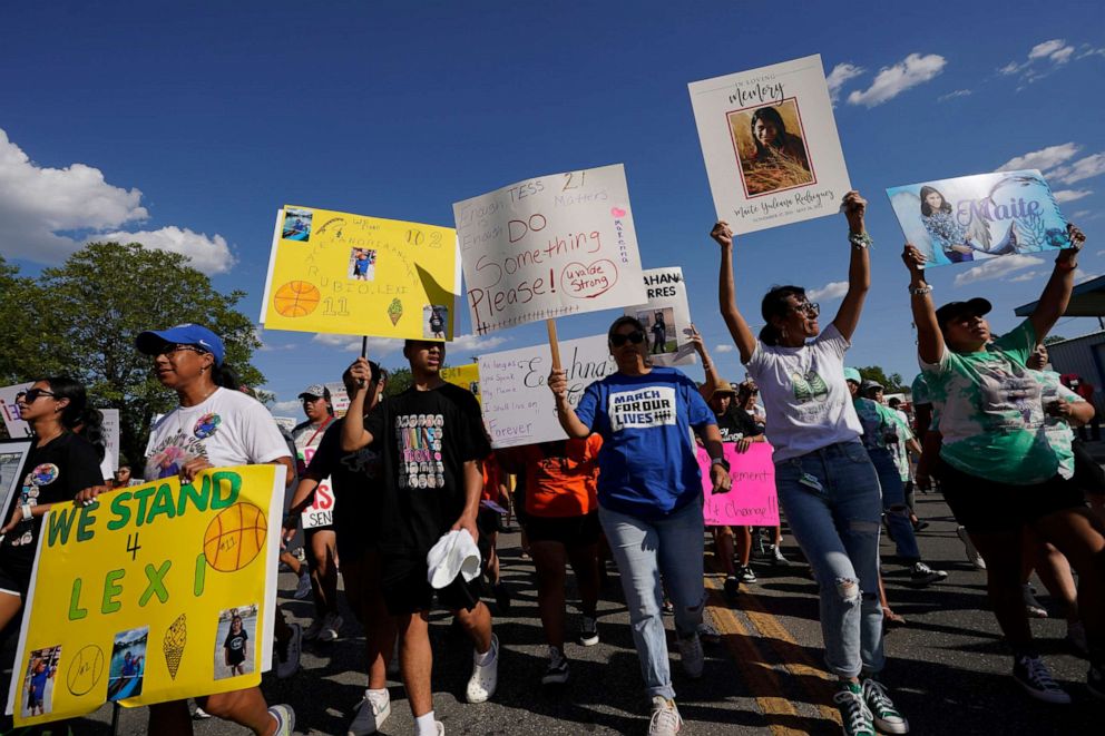 PHOTO: Family and friends of those killed and injured in the school shooting at Robb Elementary take part in a protest march and rally, Sunday, July 10, 2022, in Uvalde, Texas.