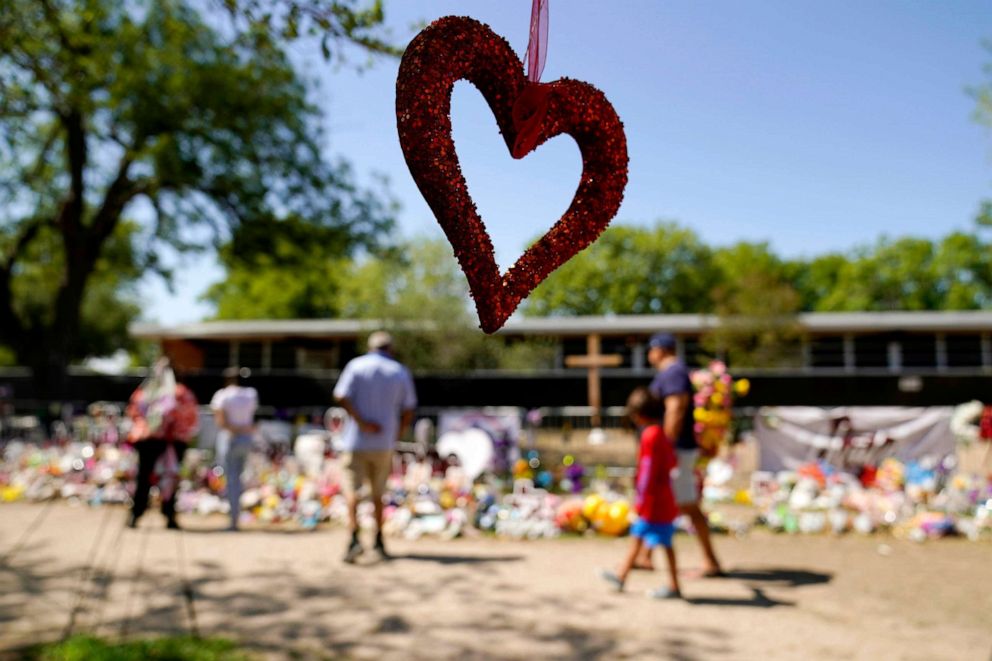 PHOTO: Visitors view a makeshift memorial honoring those recently killed at Robb Elementary School, July 11, 2022, in Uvalde, Texas.