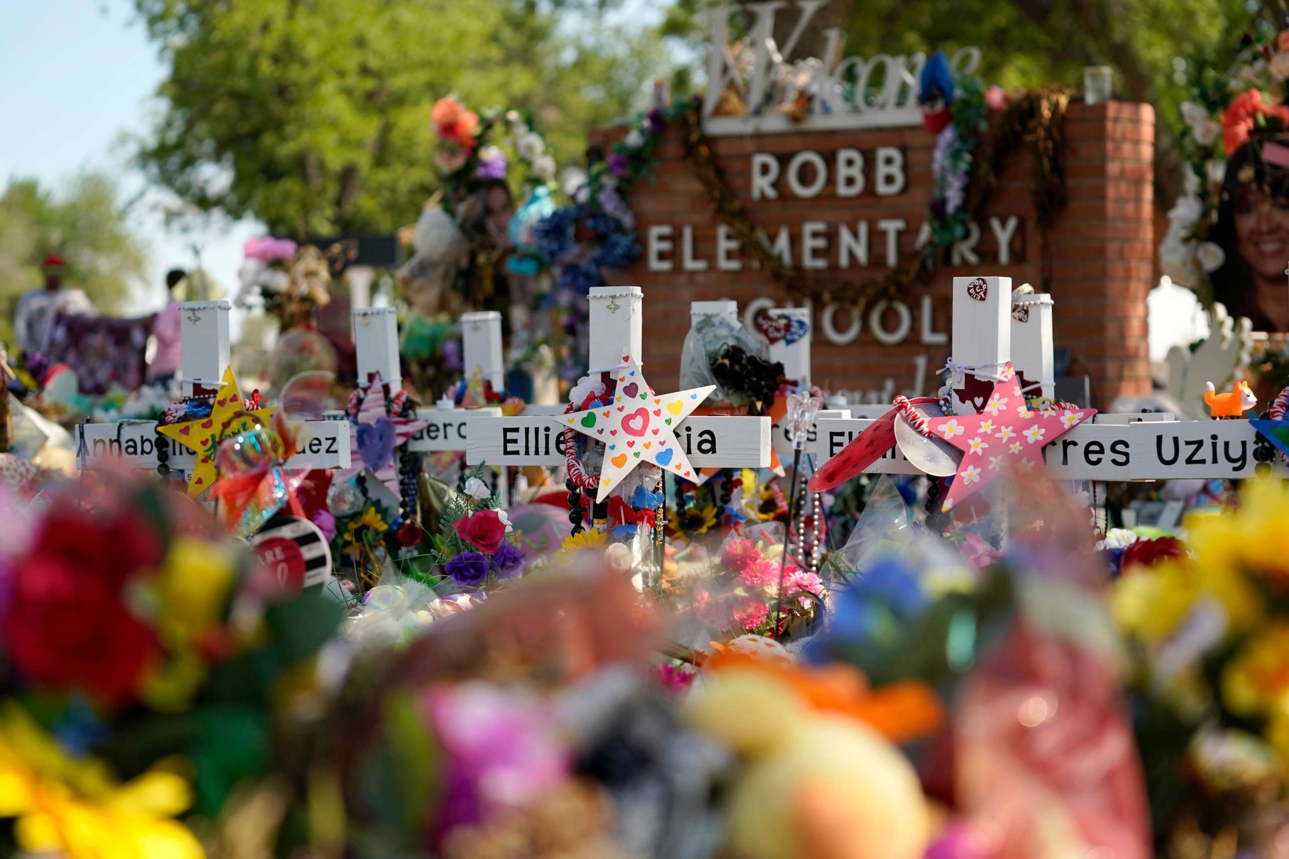 PHOTO: Crosses, flowers and other memorabilia form a make-shift memorial for the victims of the shootings at Robb Elementary school in Uvalde, Texas, July 10, 2022.