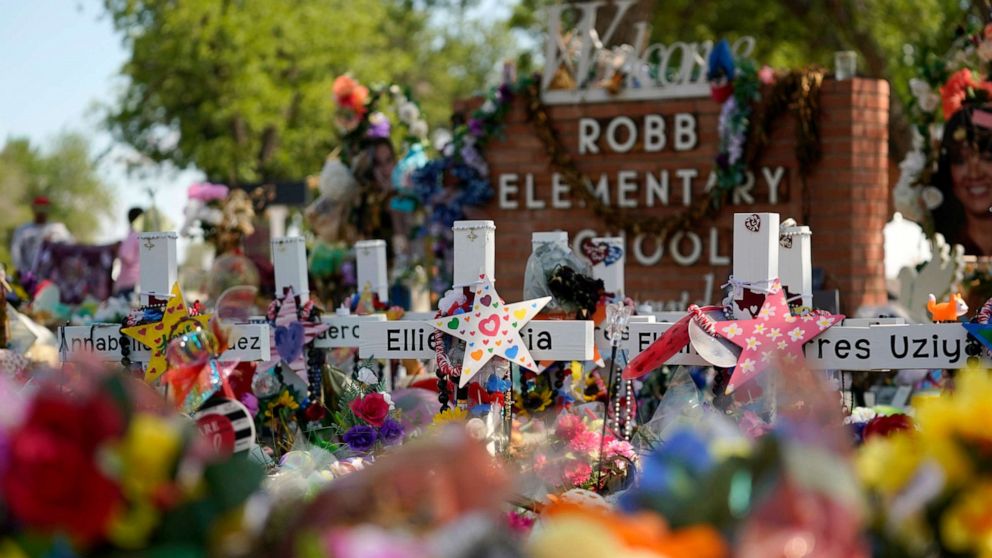 PHOTO: Crosses, flowers and other memorabilia form a make-shift memorial for the victims of the shootings at Robb Elementary school in Uvalde, Texas, July 10, 2022.