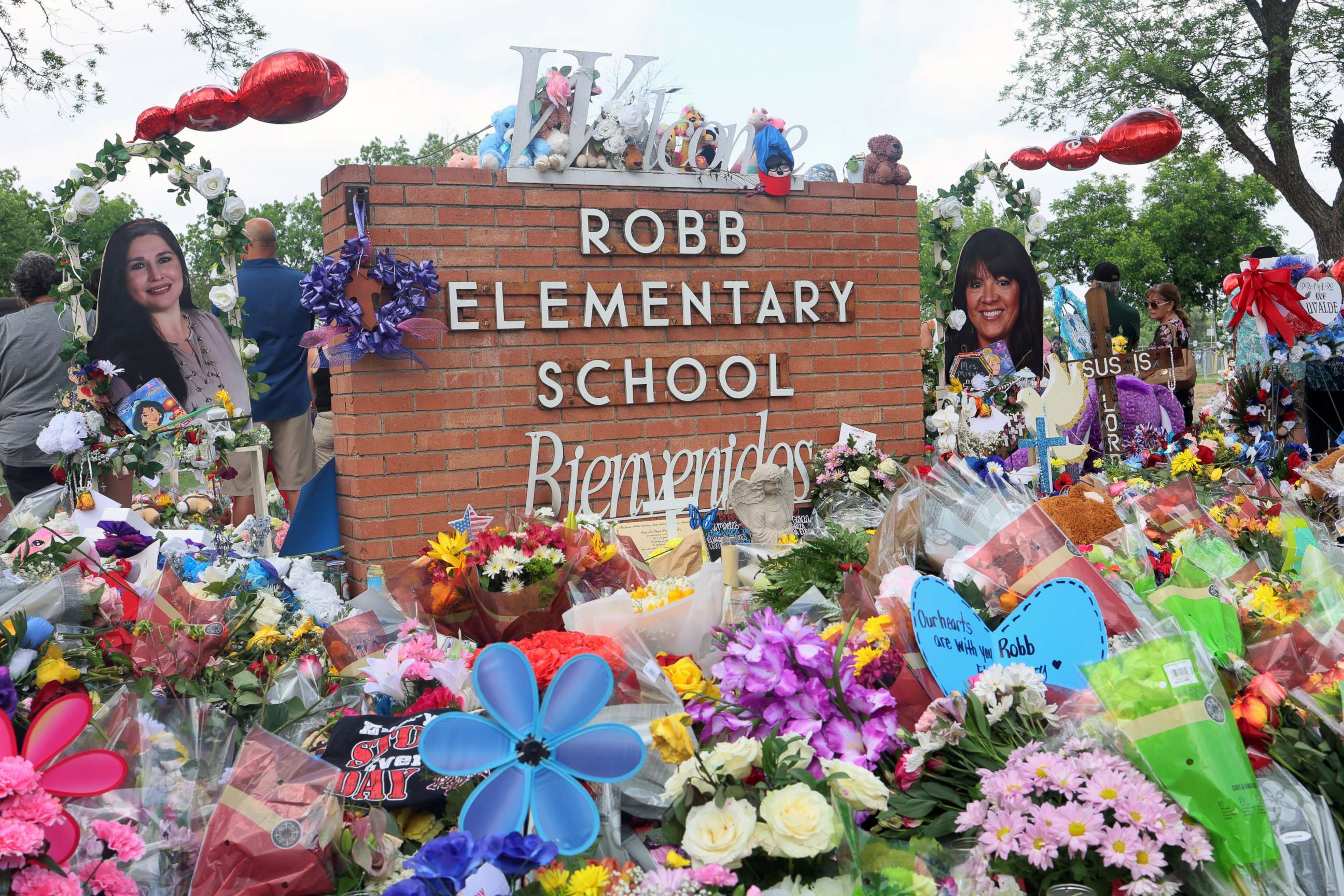 PHOTO: People visit a memorial for the 19 children and two adults killed on May 24th during a mass shooting at Robb Elementary School on May 30, 2022 in Uvalde, Texas.