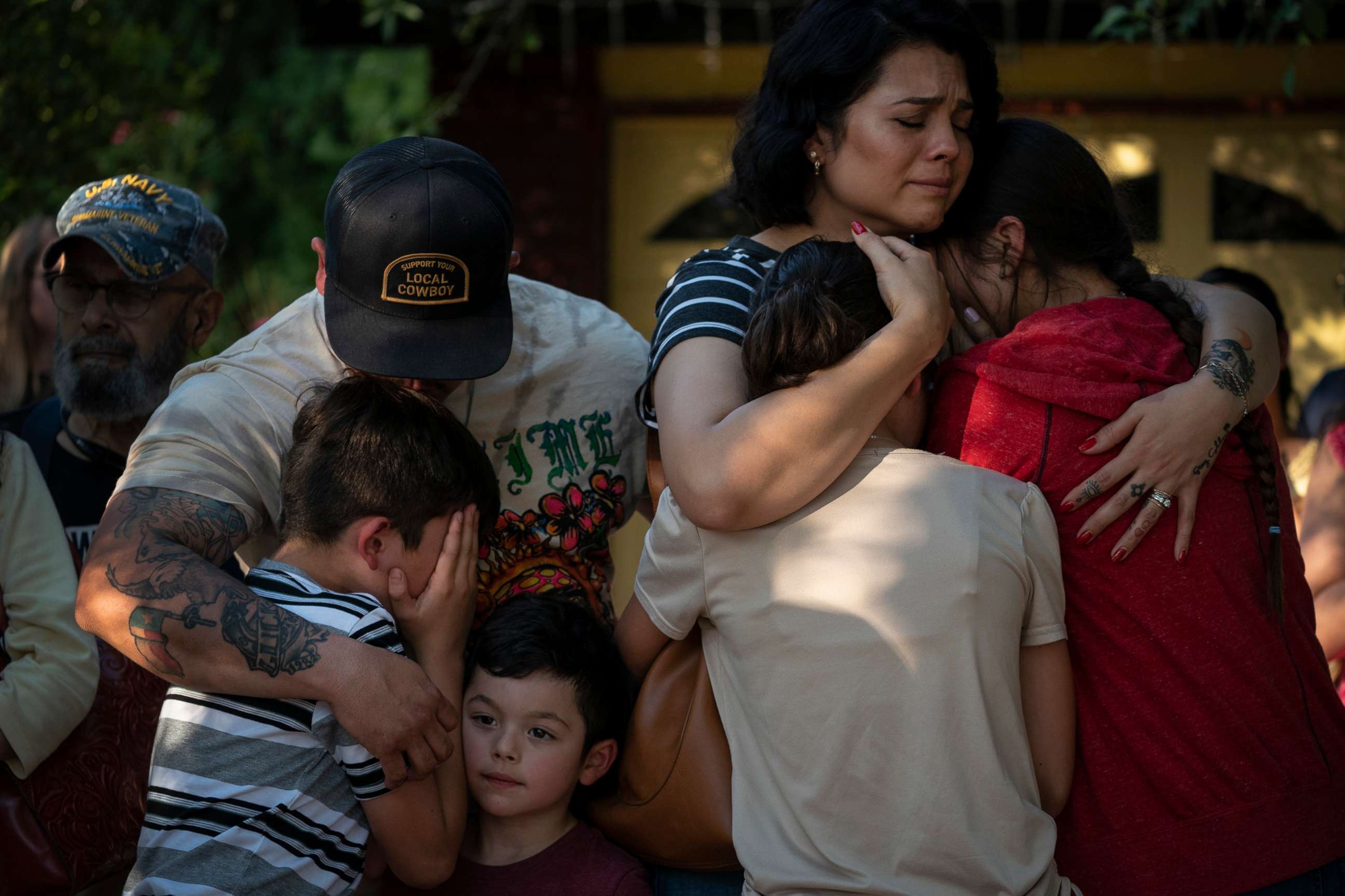 PHOTO: Raquel Martinez, comforts her two daughters while her husband, Daniel Martinez, comforts their sons outside Robb Elementary School, on May 26, 2022, in Uvalde, Texas.