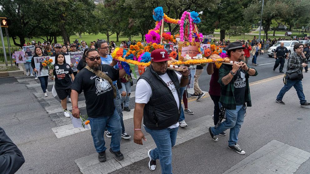 PHOTO: Families of Uvalde shooting victims carry a Dia de Los Muertos ofrenda from the Capitol to the Governor's Mansion during the March of the Children to honor lives lost in Uvalde on Nov. 1, 2022.