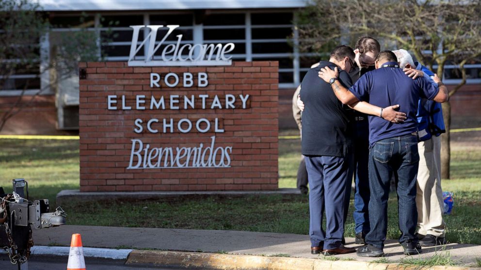 PHOTO: People gather at Robb Elementary School, the scene of a mass shooting in Uvalde, Texas, May 25, 2022.