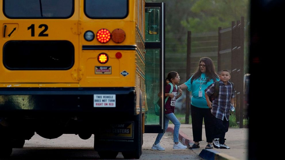 PHOTO: Students arrive at Uvalde Elementary, now protected by a fence and Texas State Troopers, for the first day of school, Sept. 6, 2022, in Uvalde, Texas.