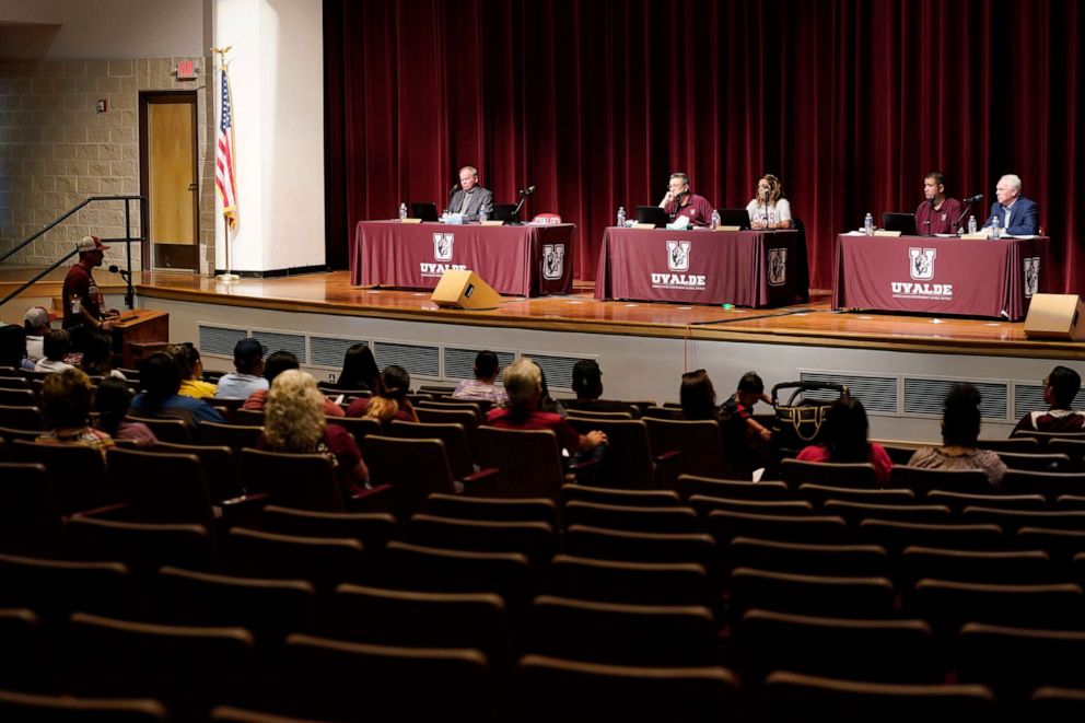 PHOTO: In this July 18, 2022, file photo, Dr. Hall Harrell, right, and members of the Board of Trustees of Uvalde Consolidated Independent School District listen to comments from parents during a special meeting in Uvalde, Texas.