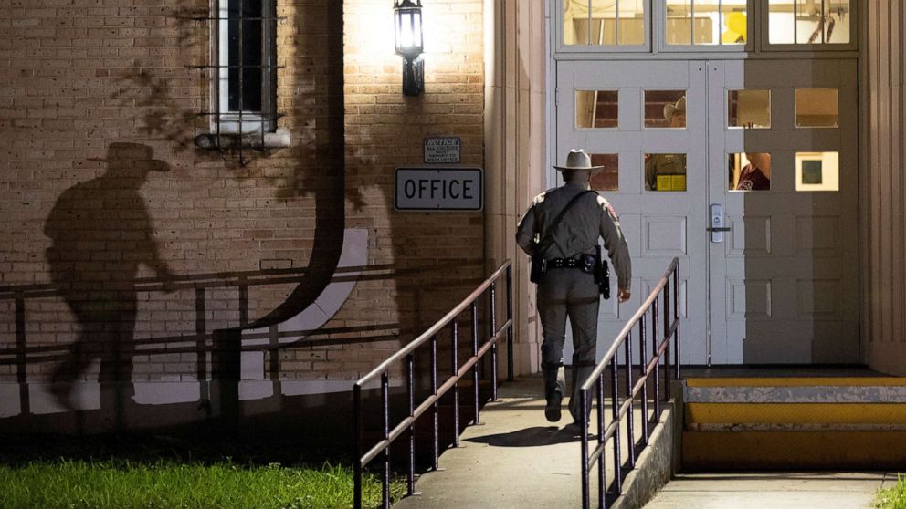 PHOTO: A Department of Public Safety trooper walks into Flores Elementary School as students get ready to return after the summer break months after the Robb Elementary mass school shooting in Uvalde, Texas, September 6, 2022.
