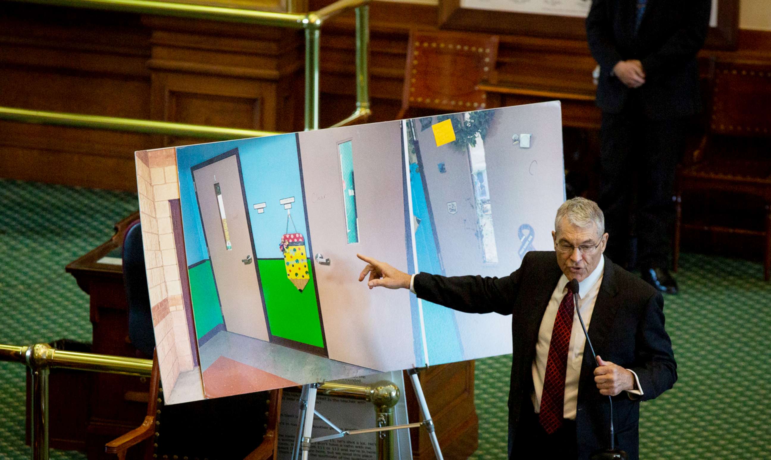 PHOTO: Department of Public Safety Director Steve McCraw uses photos of doors to present what happened during the school shooting at Robb Elementary School in Uvalde, during the hearing at the State Capitol in Austin, Texas, June 21, 2022.