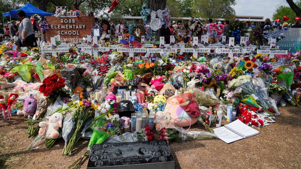 PHOTO: Flowers, toys, and other objects to remember the victims of the deadliest U.S. school mass shooting in nearly a decade, are pictured at the Robb Elementary School in Uvalde, Texas, on May 30, 2022.
